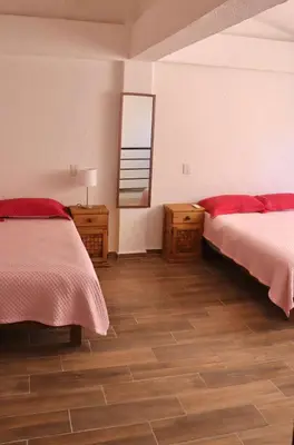 Cama o camas de una habitación en Departamento céntrico Huatulco
