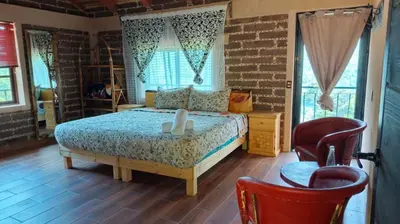 Cama o camas de una habitación en Cabañas Ticomulco