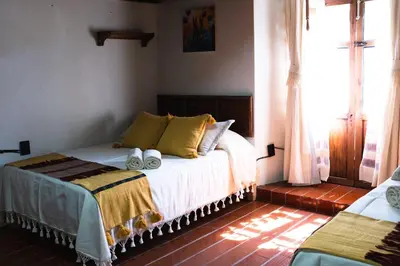 Cama o camas de una habitación en Casa Xolotl, un lugar ancestral