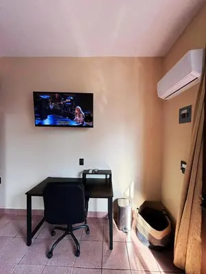 Una televisión o centro de entretenimiento en Departamento Fila