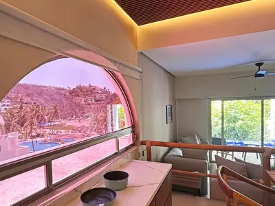 Zona de estar de Beachfront condo with private pool & fast internet