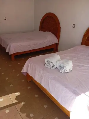 Cama o camas de una habitación en Casa rústica en zona dorada Cerca zona hoteles restaurantes y tiendas Casa privada con Muchas habitaciones
