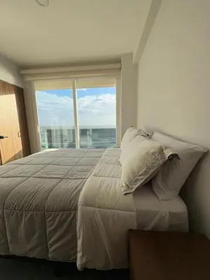 Cama o camas de una habitación en Frente a la Playa con acceso directo AC Alberca y Elevador
