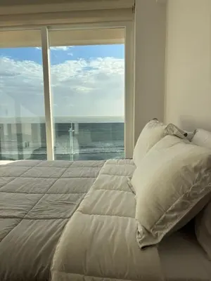 Cama o camas de una habitación en Frente a la Playa con acceso directo AC Alberca y Elevador