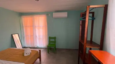 Cama o camas de una habitación en La Chinanteca, a unos minutos del centro historico