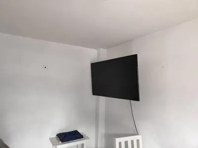 Una televisión o centro de entretenimiento en Jayau Apartamentos Cordoba