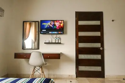Una televisión o centro de entretenimiento en Posada Doña Angela