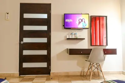 Una televisión o centro de entretenimiento en Posada Doña Angela