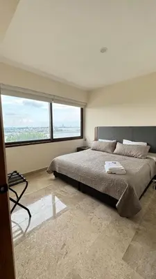 Cama o camas de una habitación en Apartamento con vista al mar y río, albercas, gym, facturamos
