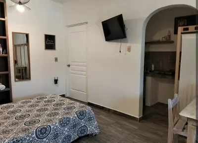 Cama o camas de una habitación en Cuatro Rumbos Hospedaje