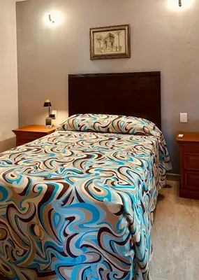 Cama o camas de una habitación en Departamentos Doña Angela