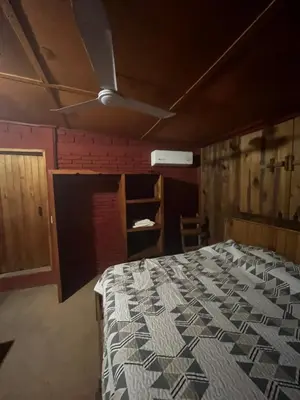 Cama o camas de una habitación en Cabañas LOS REYES