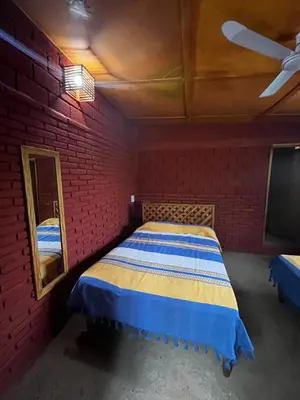 Cama o camas de una habitación en Cabañas LOS REYES