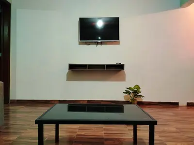 Una televisión o centro de entretenimiento en La Casa de Lu cerca de Volcanic park