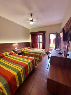 Cama o camas de una habitación en Hotel Posada del Rosario