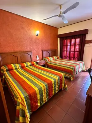 Cama o camas de una habitación en Hotel Posada del Rosario