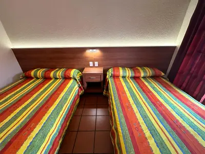 Cama o camas de una habitación en Hotel Posada del Rosario