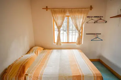 Cama o camas de una habitación en Mahue Rooms and Camping