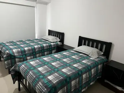 Cama o camas de una habitación en Departamento en Residencial