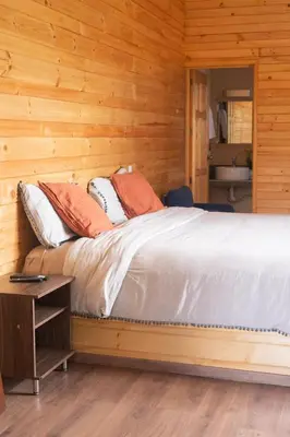 Cama o camas de una habitación en San José del Pacífico- Cabañas Camino al Cielo 1
