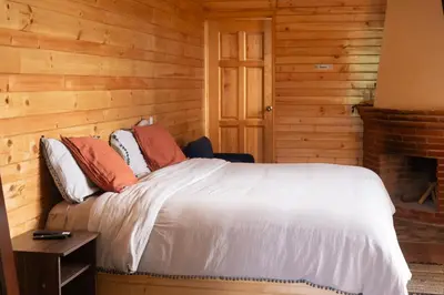 Cama o camas de una habitación en San José del Pacífico- Cabañas Camino al Cielo 1