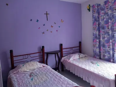 Cama o camas de una habitación en Casa familiar cerca del Centro