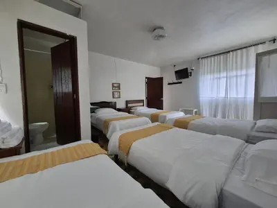 Cama o camas de una habitación en Hotel Posada Doña Carito
