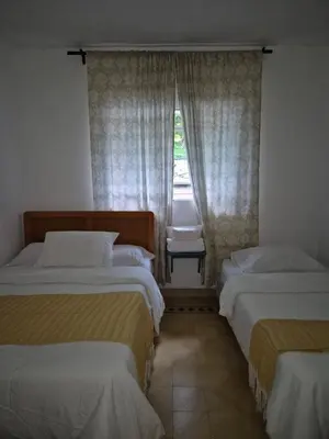 Cama o camas de una habitación en Hotel Posada Doña Carito