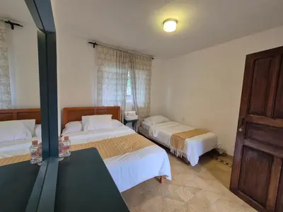 Cama o camas de una habitación en Hotel Posada Doña Carito