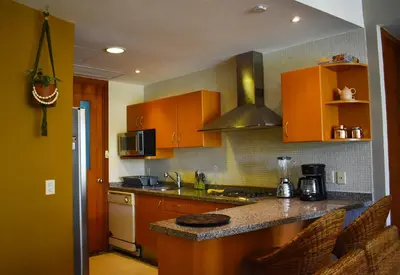 Una cocina o zona de cocina en Departamento Mayan Lakes T9 - Albercas, club de playa, tenis, pádel y más