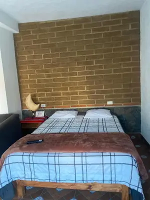 Cama o camas de una habitación en Casa HUEHUE