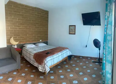 Cama o camas de una habitación en Casa HUEHUE