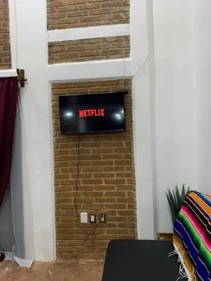 Una televisión o centro de entretenimiento en Beatiful apartment in the magical town of Orizaba
