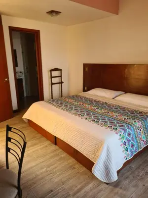 Cama o camas de una habitación en Hotel Las Violetas