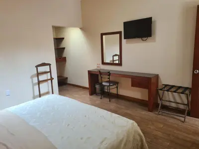 Cama o camas de una habitación en Hotel Las Violetas