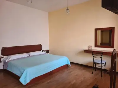 Cama o camas de una habitación en Hotel Las Violetas