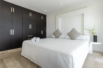 Cama o camas de una habitación en Villas Acapulco Punta Diamante