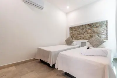 Cama o camas de una habitación en Villas Acapulco Punta Diamante