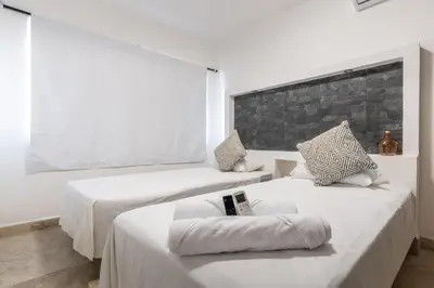 Cama o camas de una habitación en Villas Acapulco Punta Diamante