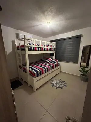 Cama o camas de una habitación en Club de Playa, Alberca y Amenidades - Departamento E4