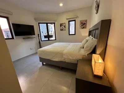 Una televisión o centro de entretenimiento en Rosarito en ValQuirico