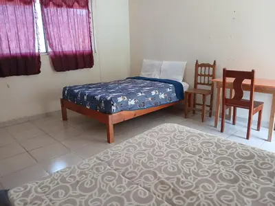 Cama o camas de una habitación en Hotel Aguila Real