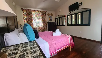 Cama o camas de una habitación en Casa Rosa Paradise