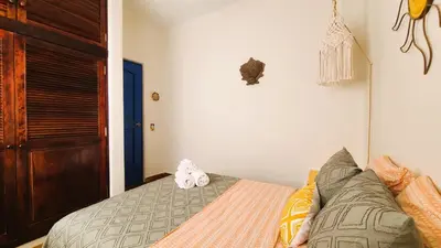 Cama o camas de una habitación en Casa Rosa Paradise