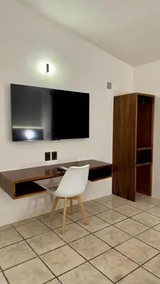 Una televisión o centro de entretenimiento en Casa Lú