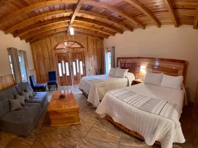 Cama o camas de una habitación en Cabañas en Zacatlán-Rancho el Mayab