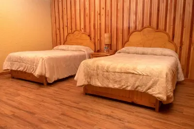 Cama o camas de una habitación en Cabañas en Zacatlán-Rancho el Mayab