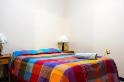 Cama o camas de una habitación en Casa Lucero Oaxaca