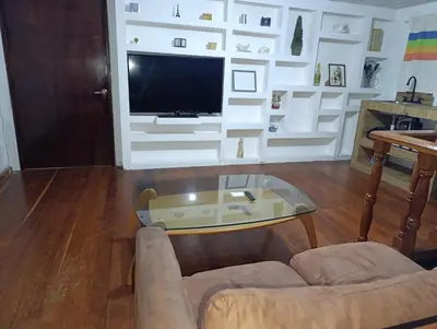 Una televisión o centro de entretenimiento en Departamento amueblado para 4 personas