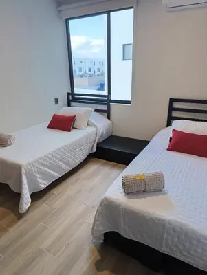 Cama o camas de una habitación en Apartamento tranquilo y familiar